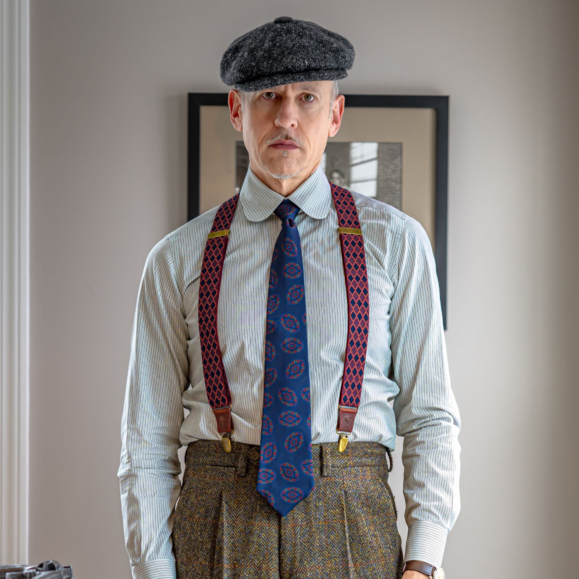 Man wearing Wiseguy Original Suspender with red, gray, black diamond pattern